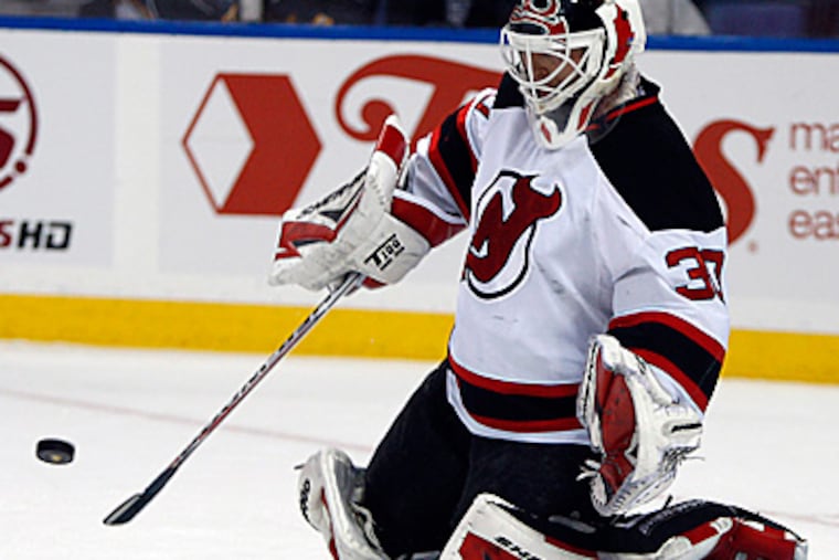New Jersey Devils goalie Martin Brodeur stops a shot against the Buffalo Sabres. Tonight, he will face the Flyers. (AP Photo/ David Duprey)