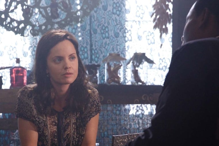 Mena Suvari stars as demon-hunter Maria Abascal and Lamman Rucker is the Rev. Elijah Bledsoe in "South of Hell." on WeTV.