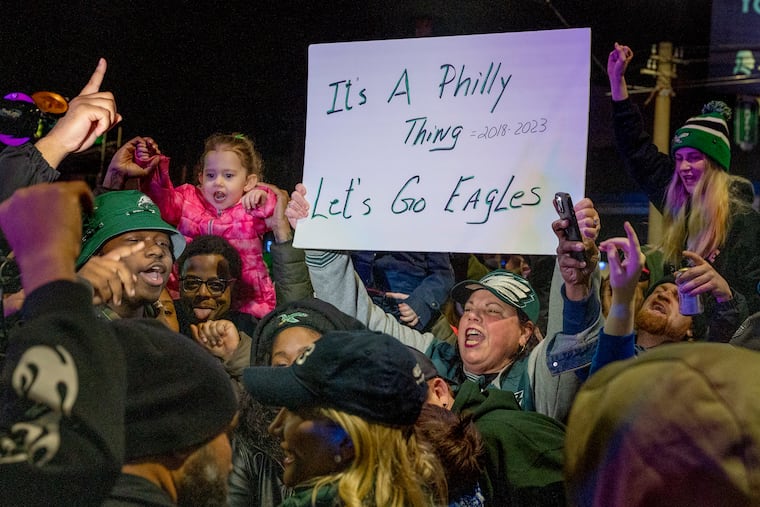 Fans celebrate at Frankford and Cottman in Mayfair Sunday following the Eagles' victory over the San Francisco 49ers in the NFC championship game.