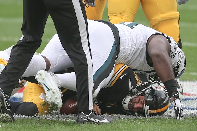 Eagles' Fletcher Cox sacks Steelers' quarterback Ben Roethlisberger during the 1st quarter at Heinz Field on Sunday.