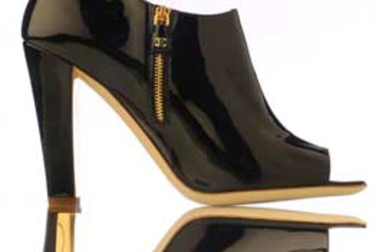 Hide the zipper? Not Chanel. It’s flaunted on short boots: $795.
