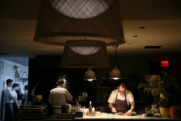 Chef Christopher Kearse plates the tuna collar at Forsythia in Philadelphia's Old City on Friday, Nov. 1, 2019.