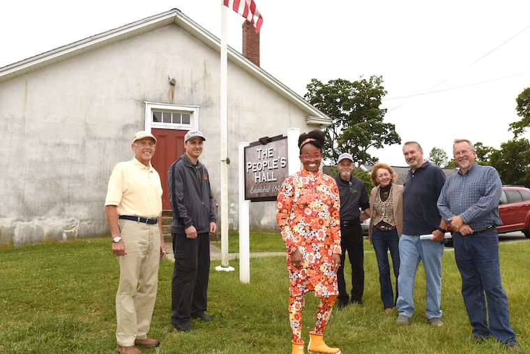 tonya thames taylor (third from left) is shown meeting at the People's Hall, with fellow trustees Robert Frye (left); James Petro III (second from left); James Petro Jr. (fourth from right); Brenda Millard (third from right); Chairman of the East Fallowfield Historic Commission, Joe McCormick (second from right); and East Fallowfield Township Supervisor John Nielson (right). The board of managers and trustees are working to raise funds for repairs on the historic structure in East Fallowfield.