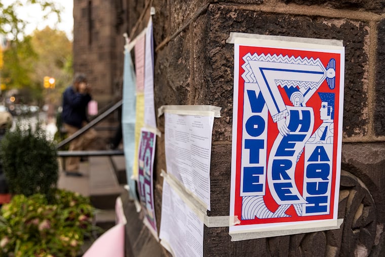 Voting signs and information seen outside the polling place at Trinity Memorial Church on Tuesday, Nov. 2, 2021.