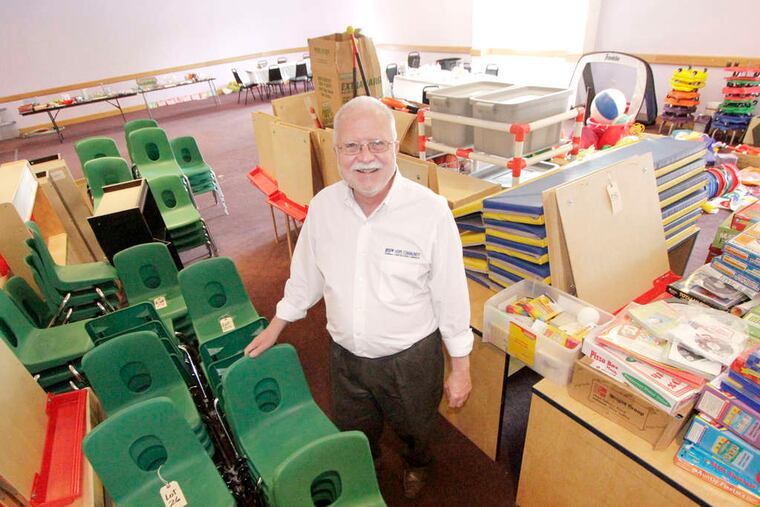 At Hope Community Charter School in Camden, which the state approved Friday, John Zeck sorts teaching material. It will start with kindergarten and first-grade classes.