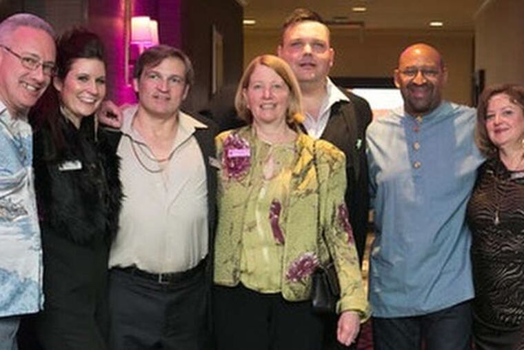 Mayor Nutter (center) with (from left) Steve Kwaszkiewicz, Donielle Powell, Rob Beck, Sally Wirts, Joshua Vieth, Annmarie O'Donnell, Britt Carpenter, Bruce Bonner, and Wayne Humphrey at the 2015 Morris Animal Refuge's 18th annual Fur Ball at the Sheraton Society Hill.