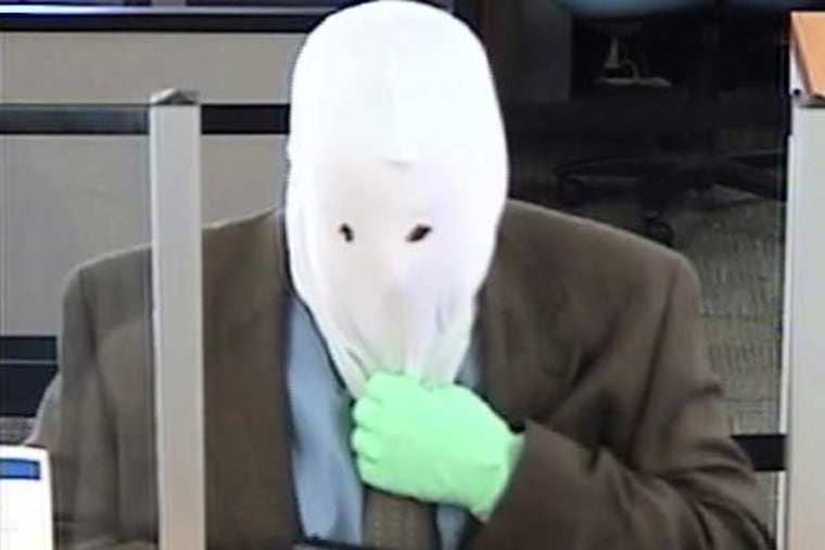 The FBI and Upper Dublin Township Police Department are seeking the public's help to identify and locate an armed robbery who struck the PNC Bank East Ambler branch located at 1015 South Bethlehem Pike in Ambler at about 8:30 a.m. Saturday. (Surveillance photo provided by the FBI)