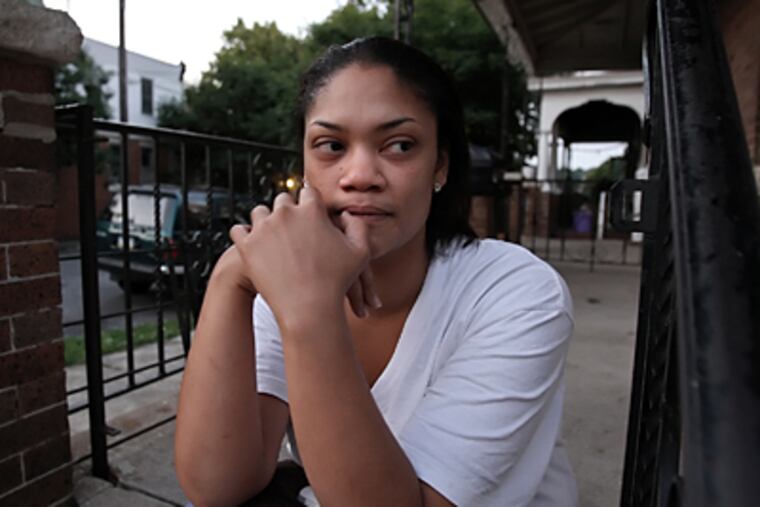 Midori Newland keeps an eye out in the area of Frankford Avenue and Dyre Street. (Steven M. Falk / Daily News)