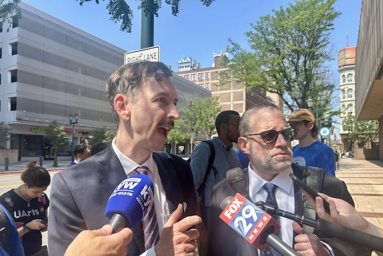 Ryan Hancock and Eric Lechtzin, lawyers for former employees of University of the Arts, speak outside federal court in Philadelphia.