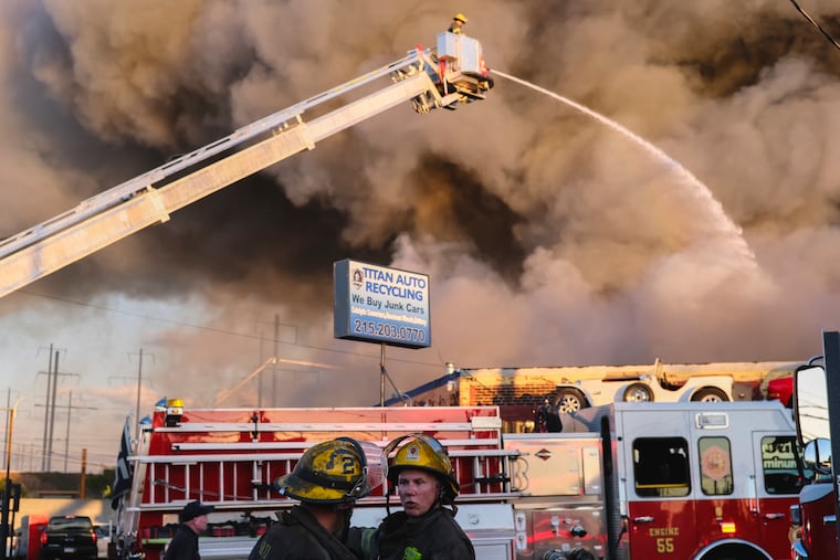A junkyard fire burns at Titan Auto Recycling in North Philadelphia on Tuesday, September 27, 2022.