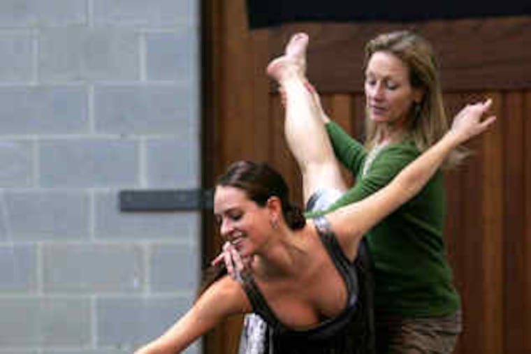 Choreographer Jeanne Ruddy helps Thayne Dibble with a pitch turn. Ruddy is completing her three-year guest-choreographer program with a new work by MacArthur winner Martha Clarke.