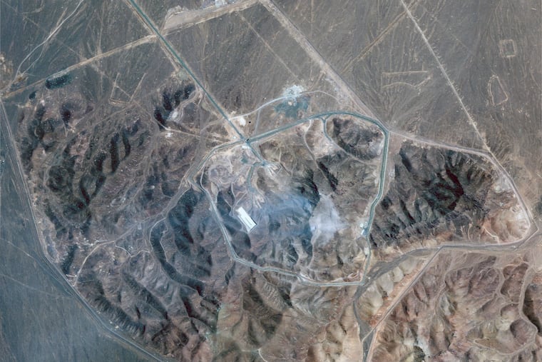 This satellite picture by Planet Labs PBC shows Iran's underground nuclear enrichment site at Fordo following U.S. airstrikes targeting the facility, on Sunday, June 22, 2025. In Philadelphia, local Iranians said they were worried for friends and family in Iran following the strikes.