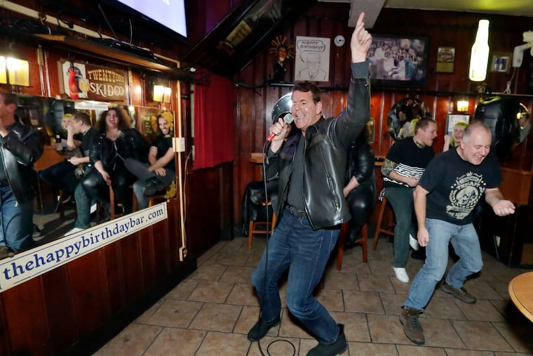 Jimmy Haberle (left) and Bob Vogel of Green Lane, Pa. sing "Don't Stop Believing" by Journey on karaoke night at Ray's Happy Birthday Bar, 1200 E Passyunk Ave. in Phila. on November 17, 2017 ELIZABETH ROBERTSON / Staff Photographer