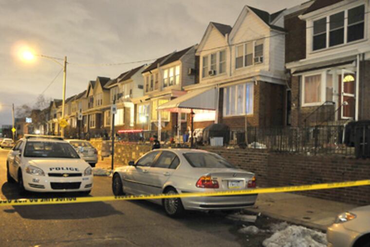 The Philadelphia Police Department at the scene of a double homicide
at 5430 Rutland St. on Monday in Northeast Philadelphia. (Maria Pouchnikova / Staff Photographer)