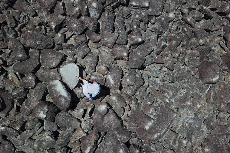 Curtis Nolley, 64, Harrisonburg, VA explores the ringing rocks of Upper Black Eddystone Thursday July 12, 2017. DAVID SWANSON / Staff Photographer .