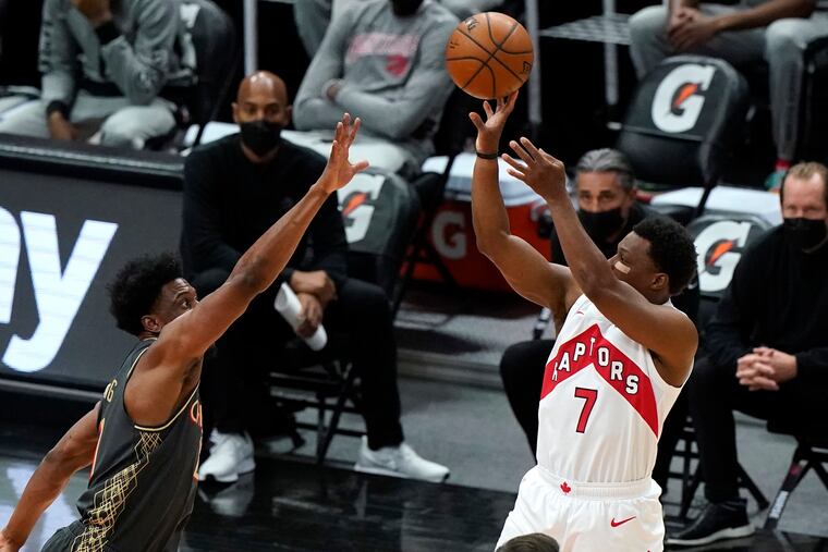 Kyle Lowry (right) wants a three-year, $90 million contract in free agency.