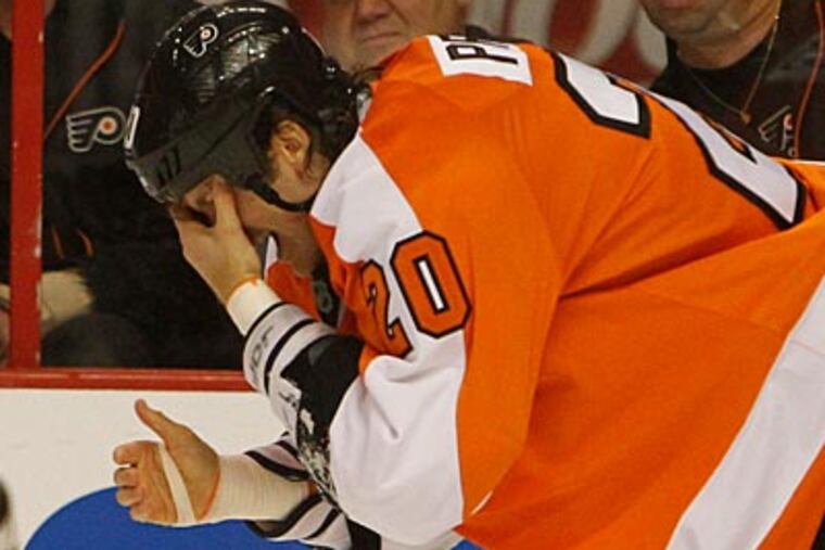 Chris Pronger left Monday's Flyers game after taking a stick to the face and did not return. (Ron Cortes/Staff Photographer)