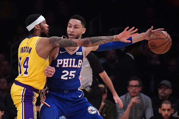 Ben Simmons is guarded by the Lakers' Brandon Ingram during Tuesday's win.