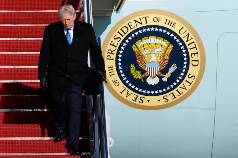 President Donald Trump walks down the stairs of Air Force One upon his arrival Monday at Joint Base Andrews, Md.