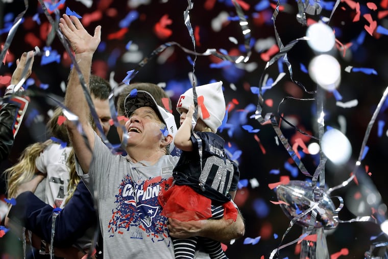 Bill Belichick celebrates as confetti falls around him and a grandchild after the Patriots' sixth Super Bowl title in the last 18 years.