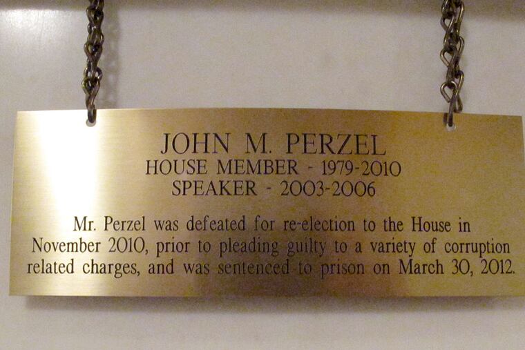 The plaque hanging in the Pennsylvania Capitol below the official portrait of former House Speaker John Perzel and three other former top state lawmakers in Harrisburg, Pa., now includes information about their criminal histories. Plaques that add those details to the dates the four men served were hung Tuesday, July 15, 2014. (AP Photo/Marc Levy)