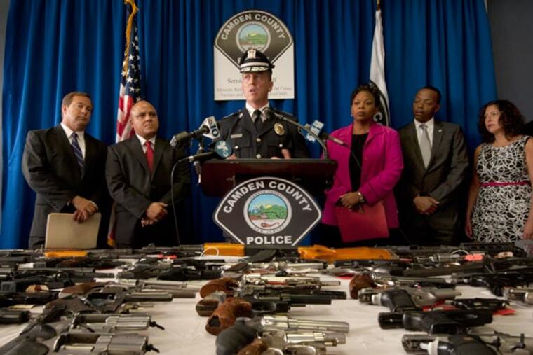 Press conference to discuss crime in Camden on Aug. 6, 2013. Here, from left to right: Freeholder Lou Cappelli; City Council President Frank Moran; Police Chief Scott Thomson; Mayor Dana Redd; Mininster Wasim Muhammad; and Freeholder Michelle Gentek. ( APRIL SAUL / Staff )