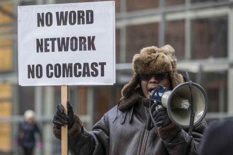 The Rev. W. J. Rideout III, pastor of All Gods People Church from Detroit, uses the bullhorn to spur his congregation to chant in front of the Comcast building last January. Members of the All Gods People Church from Detroit protested outside the Comcast Center in the hopes of having Comcast not drop the Word Network from its lineup.