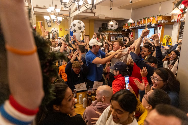 The crowd cheers and celebrates USA’s first goal against the Netherlands in the World Cup at Brauhaus Schmitz bar in Philadelphia, Pa., on Saturday Dec. 3, 2022.