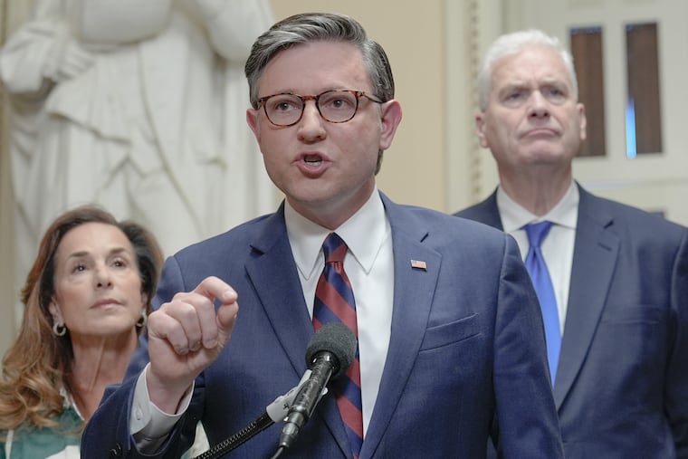 Speaker of the House Mike Johnson, R-La., center, speaks while House Majority Whip Tom Emmer R-Minn., right, and House Republican Conference Chair Lisa McClain, R-Mich., left, listen during a news conference on Capitol Hill, Friday, March 27, 2026, in Washington.