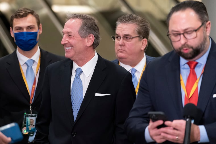 Michael van der Veen, second from left, an attorney for former President Donald Trump, after Trump was acquitted in his second impeachment trial, along with William J. Brennan, third from left, another Trump lawyer, and Trump spokesperson Jason Miller, right.