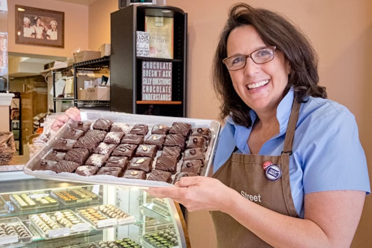 Owner Gail Warner at Bridge Street Chocolates in Phoenixville with her new line of chocolate-covered marshmallows. ( ED HILLE / Staff Photographer )