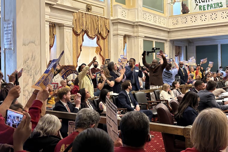 Supports of Councilmember Nicolas O'Rourke's renter protection bills celebrate as Council passes the legislation at City Hall on Thursday.