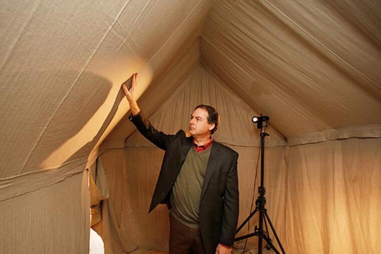 R. Scott Stephenson, project director, checks an interior ceiling of the replica of George Washington's wartime field tent on December 3, 2013.( MICHAEL S. WIRTZ / Staff Photographer )