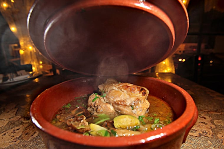 steaming stewed rabbit at Koo Zee Doo, one of the five favorites in the "Updated International" category. (David M Warren / Staff Photographer)