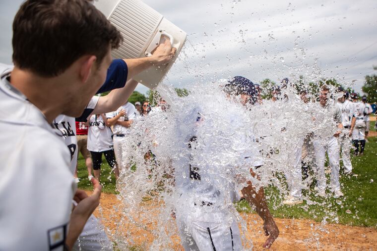 La Salle baseball players pour water over head coach Kyle Werman after defeating Cardinal O'Hara, 4-1, for the Catholic League championship at Widener University in Chester, PA on Saturday, May 25, 2019.