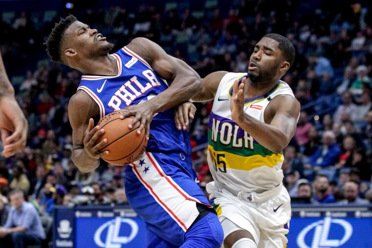 Jimmy Butler drives to the basket against New Orleans' E'Twaun Moore during the first half of the Sixers' 111-110 win Monday night.