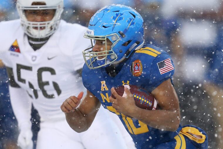 Navy quarterback Malcolm Perry (10) runs the ball during the annual Army-Navy football game at Lincoln Financial Field on Saturday, Dec. 9, 2017. TIM TAI / Staff Photographer