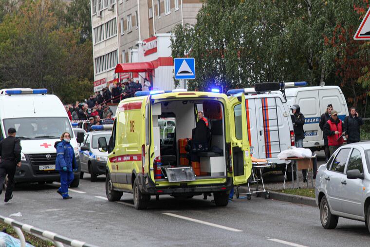 Police and paramedics work at the scene of a shooting at school No. 88 in Izhevsk, Russia.