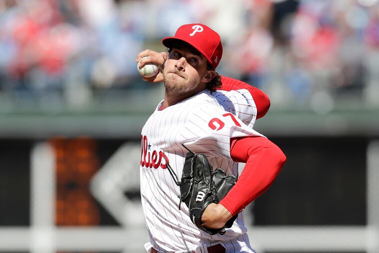 Phillies starting pitcher Aaron Nola throws a first-inning pitch against the Atlanta Braves on Thursday, March 28, 2019 in Philadelphia.