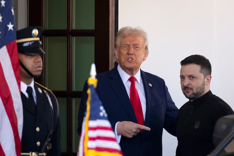 Ukraine President Volodymyr Zelensky (right) is greeted by President Donald Trump as he arrives at the White House on Friday.