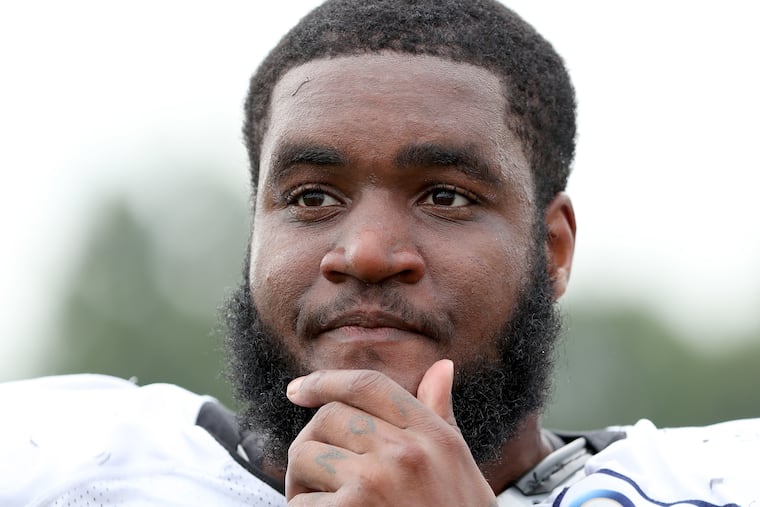Eagles rookie defensive end Shareef Miller talks with reporters Tuesday at training camp.