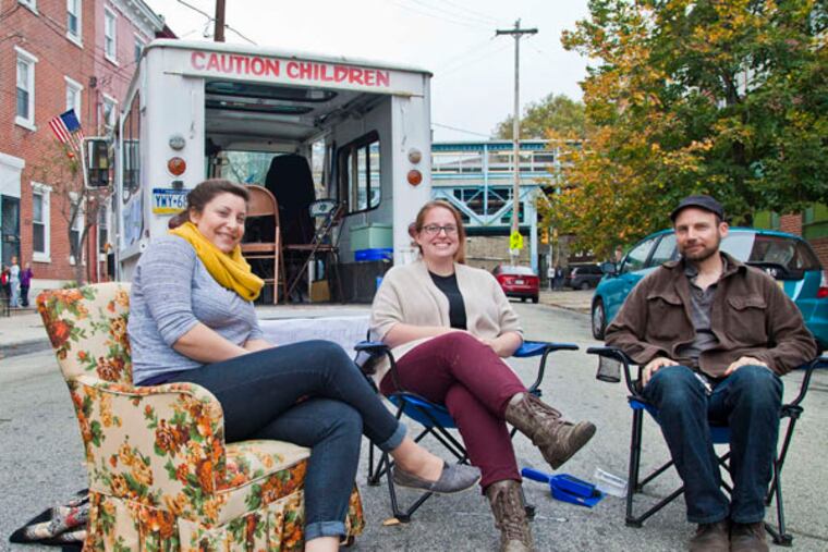 At a history block party on East Huntingdon with the Philadelphia Public History Truck are (from left) exhibition designer Jordan Klein, founder and curator Erin Bernard, and Jeff Carpineta, a resident who donated the truck. (Photo: Laura S. Kicey)