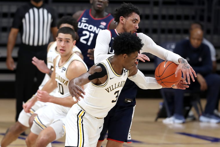 Brandon Slater of Villanova strips the ball away from James Bouknight, right, of UConn during the second.
