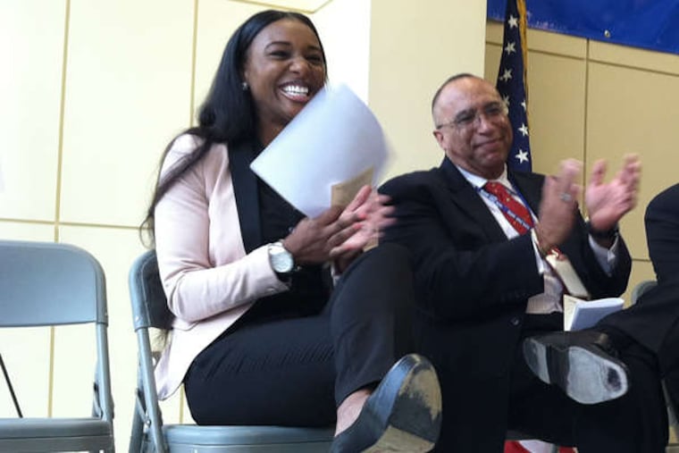 Markeytia Poindexter, now a DHS social worker, with center director Marq F. Temple. (Carolyn Davis / Staff)