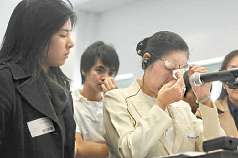 Suong Nguyen wipes tears as she addresses the SRC. She detailed her grandson’s treatment after he was beaten. (SARAH J. GLOVER / Staff Photographer)