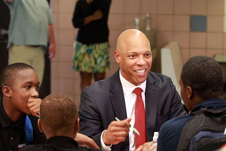 Dr. William R. Hite Jr., superintendent of The School District of Philadelphia, has lunch with 9th-grader John Span (left) and other South Philadelphia High School students in the cafeteria, on Monday Sept. 9, 2013. (DAVID SWANSON / Staff Photographer)