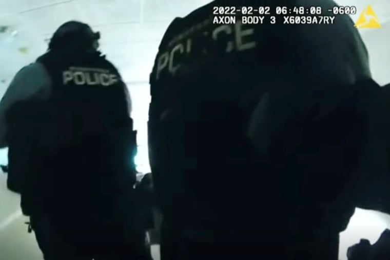 In this image taken from Minneapolis Police Department body-cam video and released by the city of Minneapolis, police enter an apartment on Wednesday moments before shooting 22-year-old Amir Locke. Minneapolis Mayor Jacob Frey has imposed a moratorium on no-knock warrants after Locke was killed as a SWAT team carried out a search warrant in a downtown apartment.