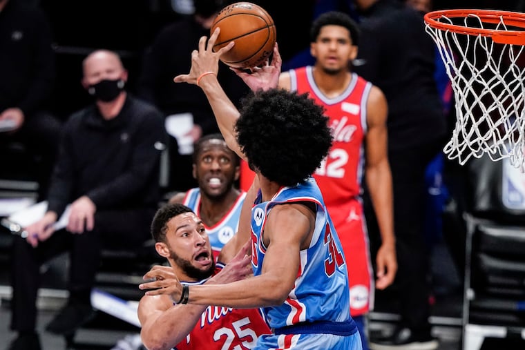 Brooklyn Nets' Jarrett Allen (31) blocks a shot by Philadelphia 76ers' Ben Simmons (25) during the first half of an NBA basketball game Thursday, Jan. 7, 2021, in New York. (AP Photo/Frank Franklin II)