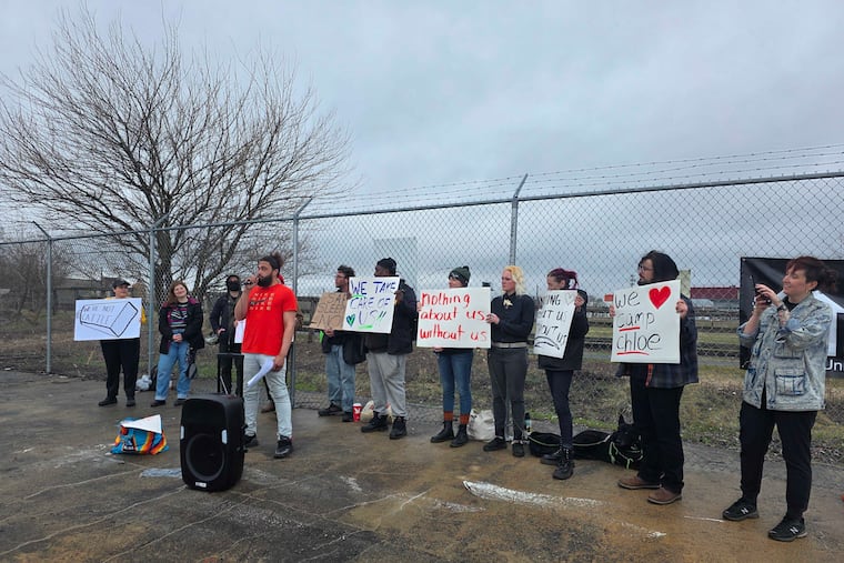 A resident of Camp Chloe, an encampment along the Delaware River Trail in South Philadelphia, cites a list of demands for Mayor Cherelle L. Parker.