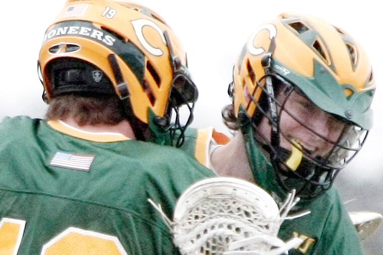 Clearview's Jackson Specht is hugged by teammate # 19 Collin Love after Specht scored in the first half. (Elizabeth Roberston/Staff Photographer)